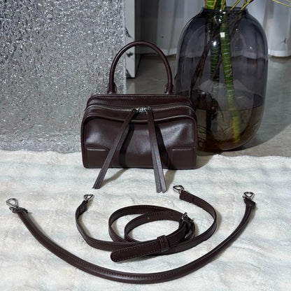 Front view of a luxury shoulder tote bag showing design and strap