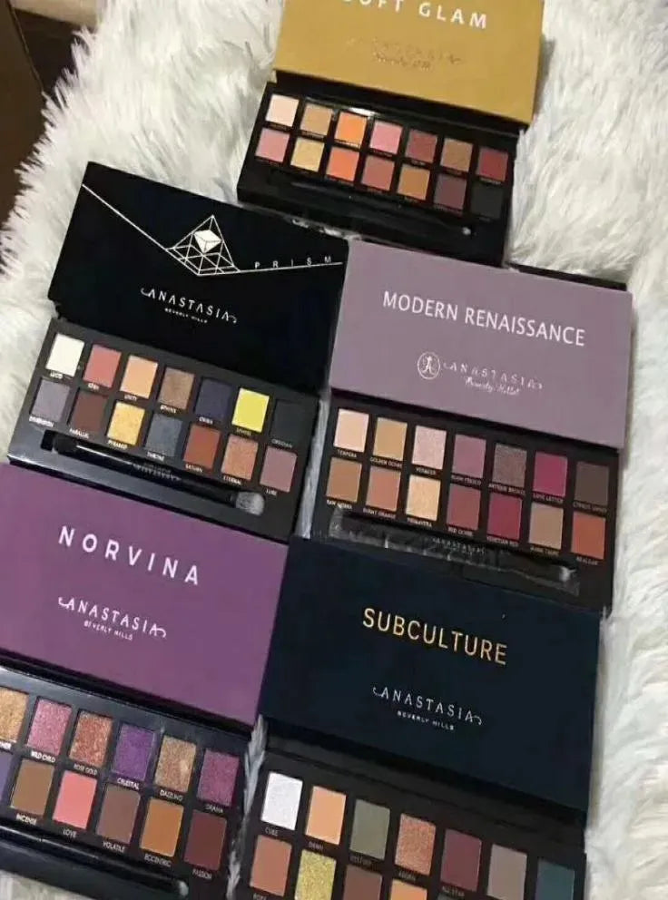 Front view of 14-color eyeshadow palette showing chocolate and peach shade arrangement