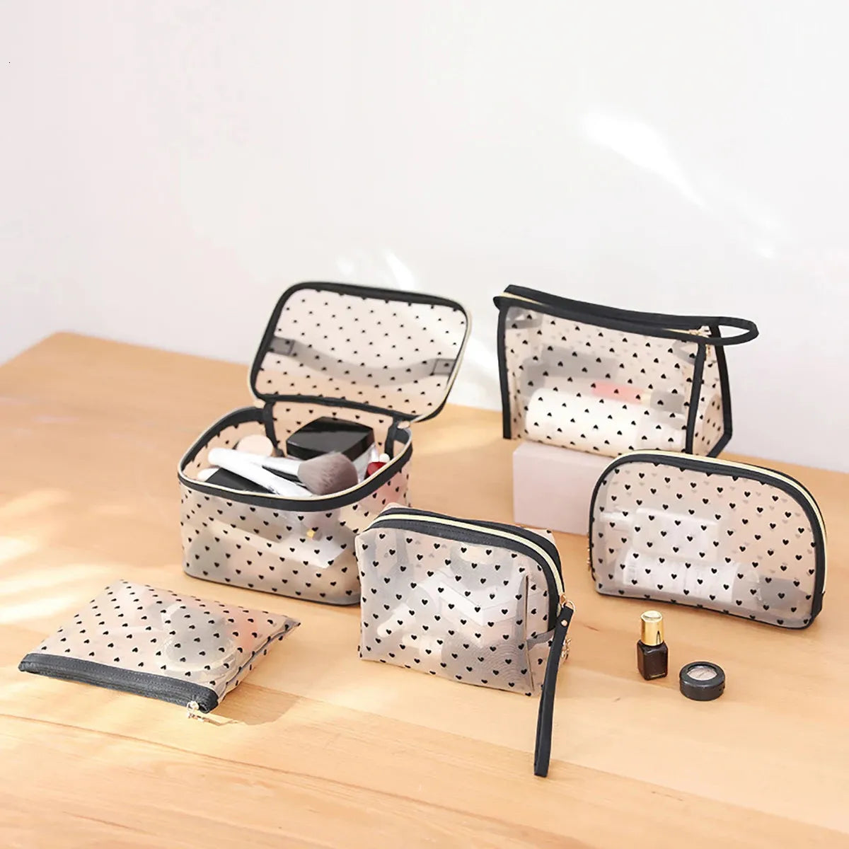 Set of five cosmetic bags arranged by size