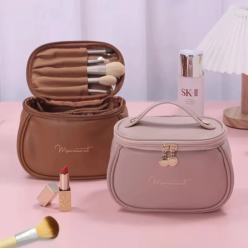 Front view of a PU leather cosmetic bag with multiple compartments