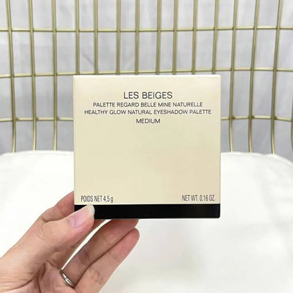 Eyeshadow palette open showing all five color variations and compact design