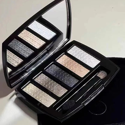 Five-color eyeshadow palette showing glitter and pearly finishes