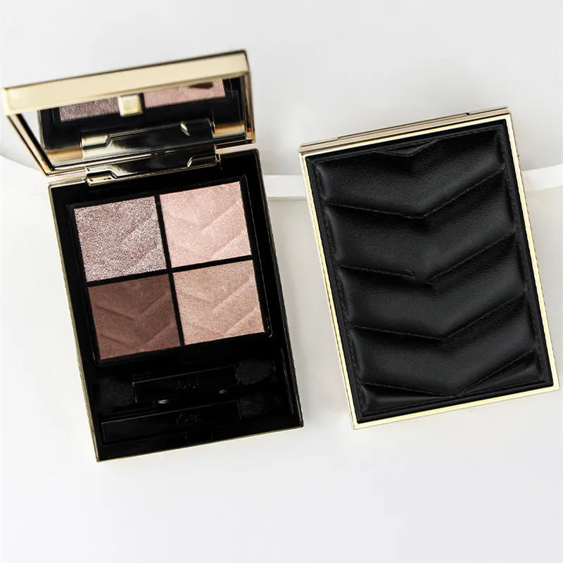 Mini clutch eyeshadow palette open with four eyeshadow pans visible