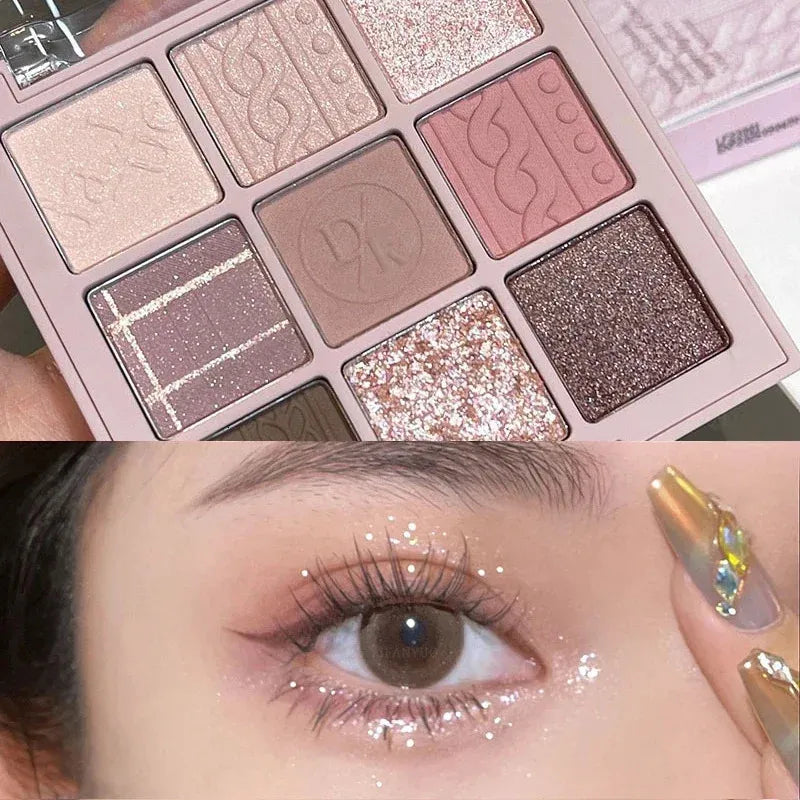 Close-up view of eyeshadow shades including pink and pearlescent options