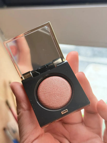 Three-color eyeshadow palette showing matte and metallic shades