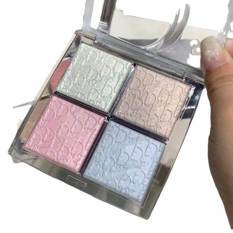 Close-up view of eyeshadow palette showing four coordinated shades for highlighting and contouring