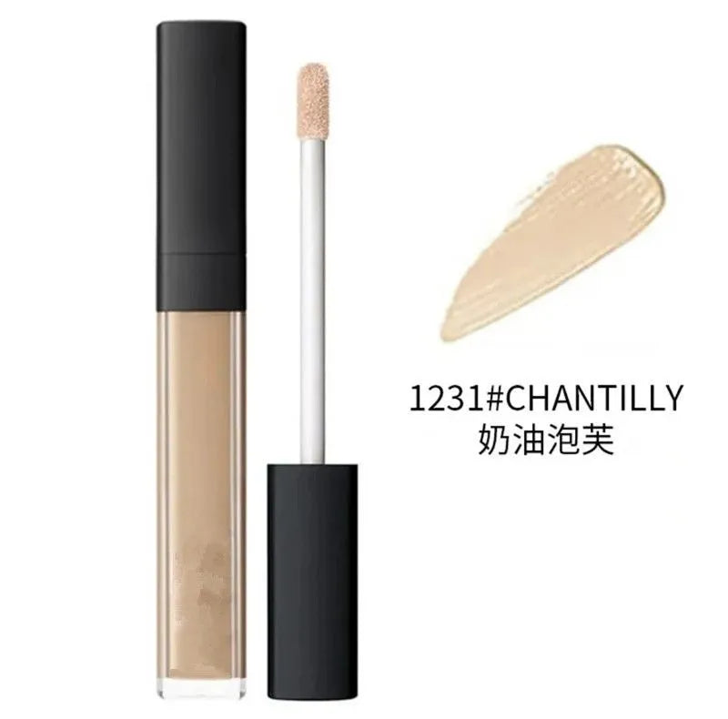 Four different shades of liquid concealer displayed in cosmetic containers