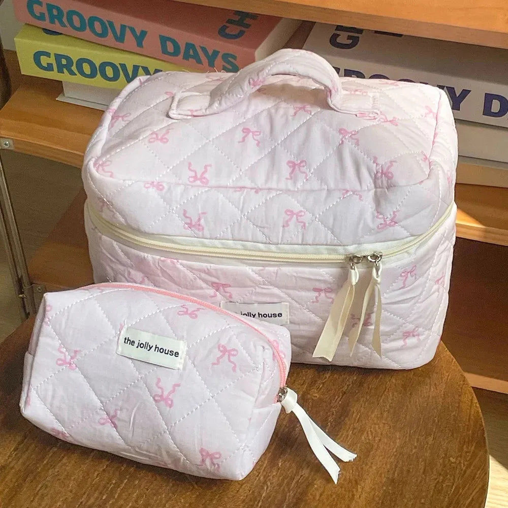 Cosmetic bag displayed next to personal care items for scale