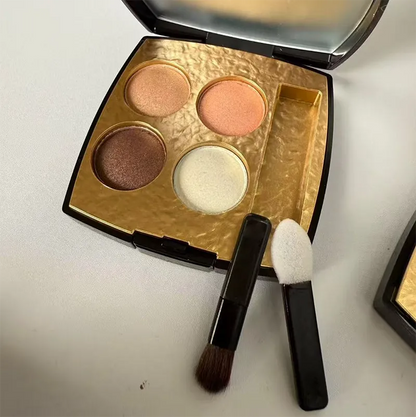 Dual-ended applicator brush included with eyeshadow palette