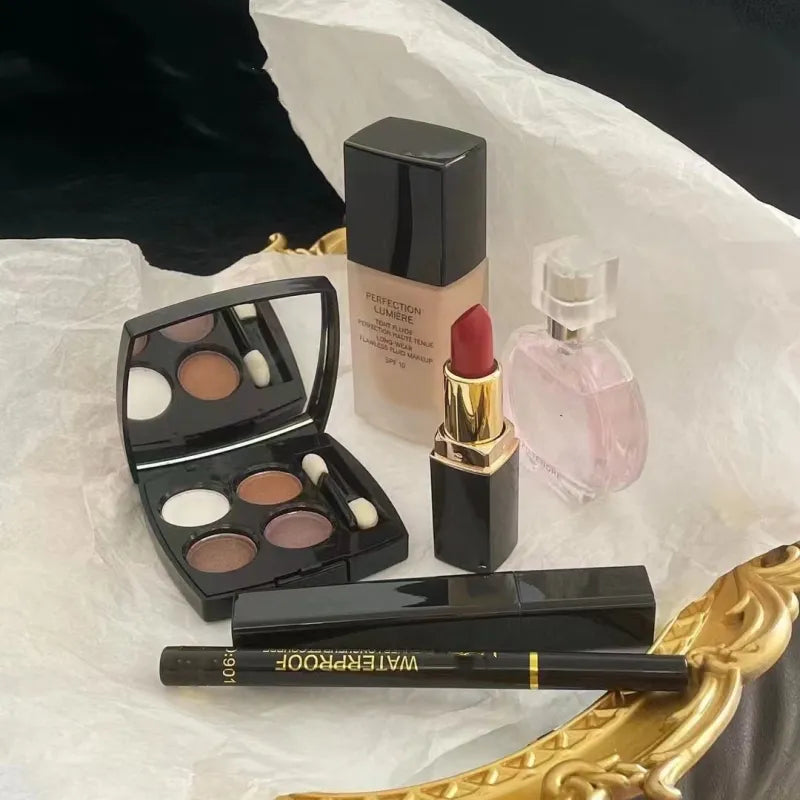 Close-up view of lipsticks, eyeliner, and mascara from the makeup kit