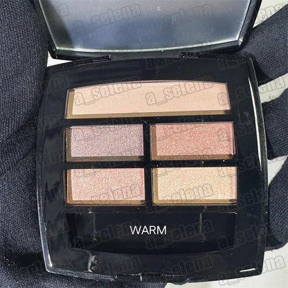 Eyeshadow palette with open lid and four matte shades arranged in a row