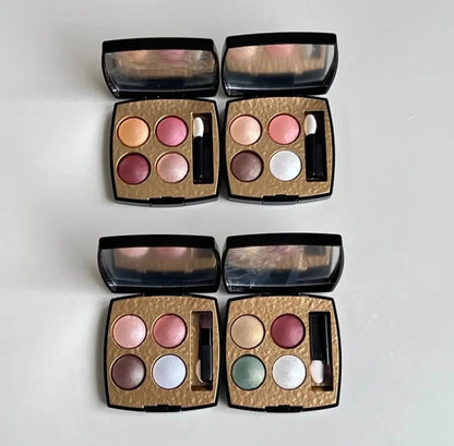 Eyeshadow palette open showing matte and shimmer texture details