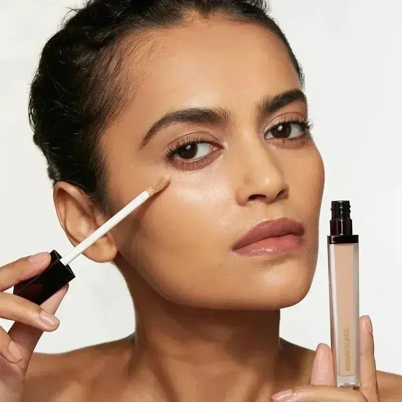 Close-up view of concealer stick tip showing creamy texture