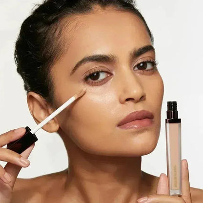 Close-up view of concealer stick tip showing creamy texture