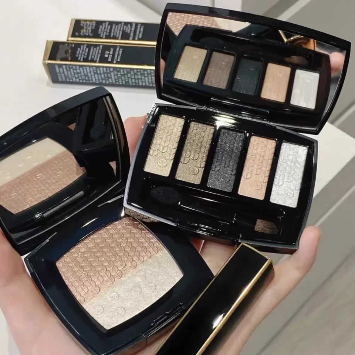 Close-up view of the pressed powder eyeshadow shades showing texture and colors