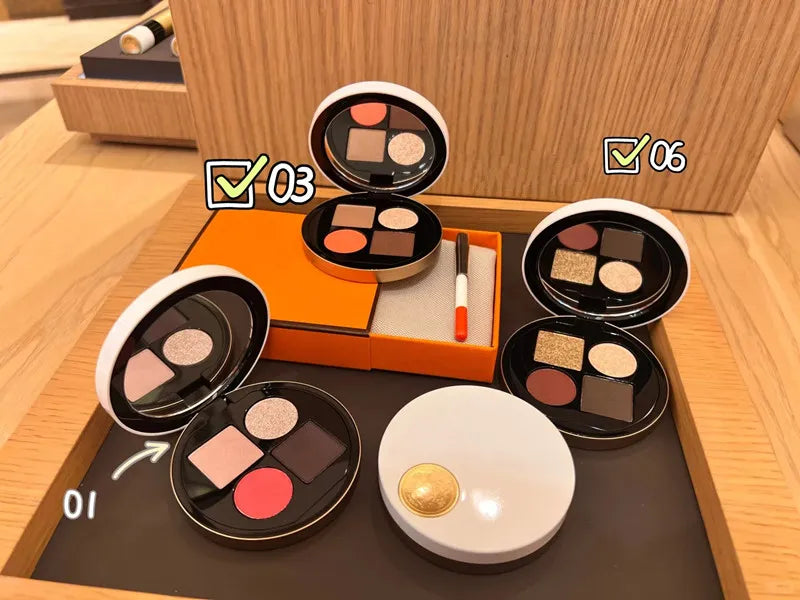 Four compact eyeshadow palettes arranged with six natural color variations