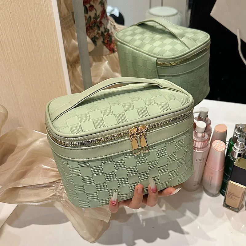 Checkered pattern cosmetic bag with zipper closure