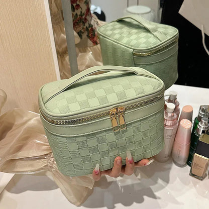 Checkered pattern cosmetic bag with zipper closure
