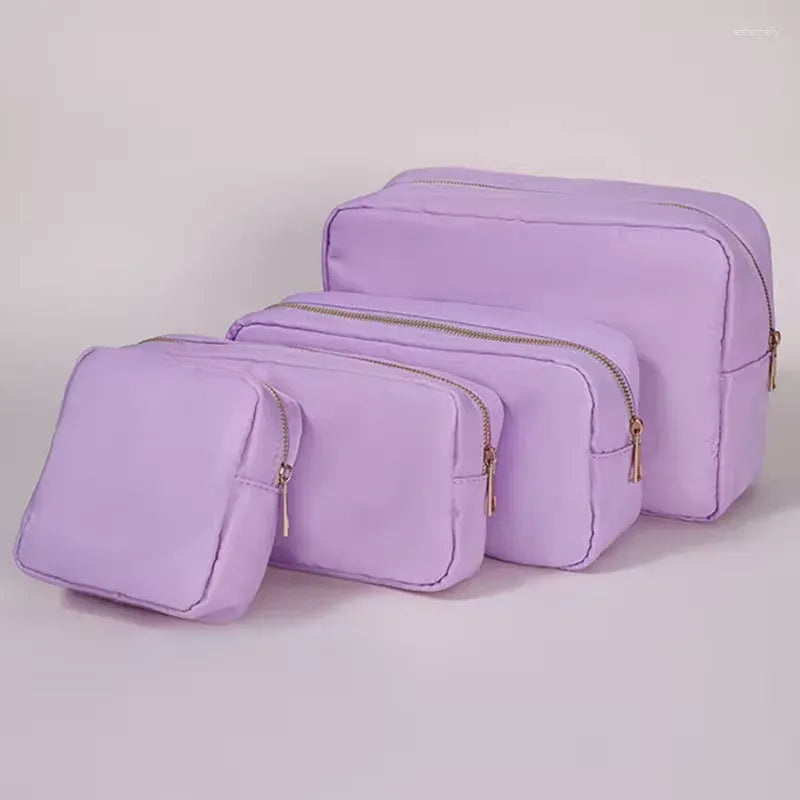 Waterproof nylon cosmetic bag in multiple color options displayed together