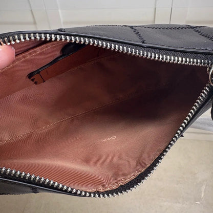 Front view of leather tote bag showing main compartment and strap