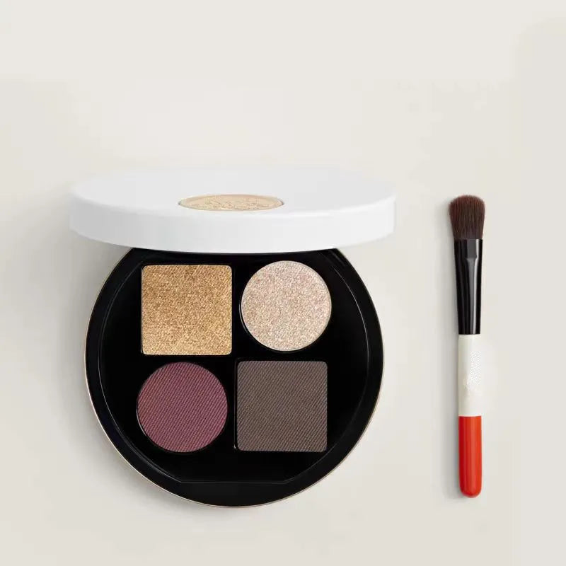 Eyeshadow palette open displaying marine, fume, and mordre color options