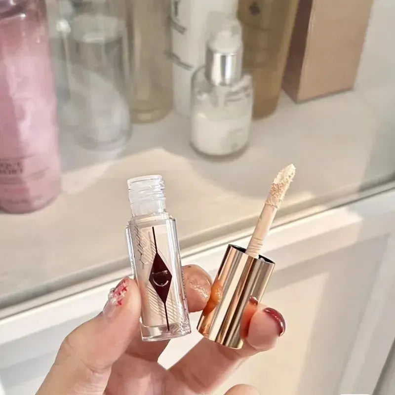 Close-up view of concealer cream being applied to skin
