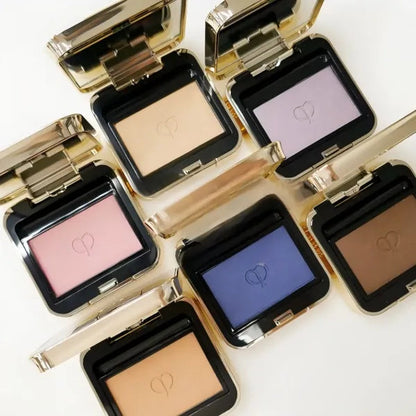 Close-up view of matte and pearlescent powder textures in the palette