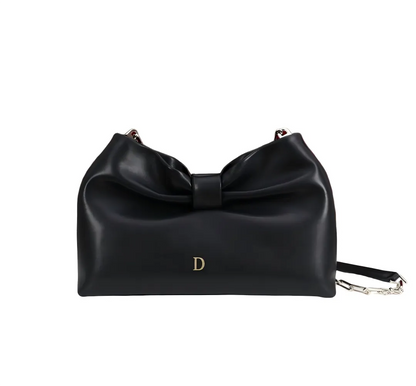 Front view of women's clutch bag with bow design in dark grey color