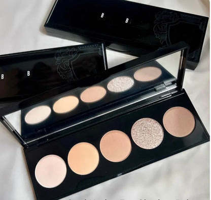 Front view of a 5-color eyeshadow palette showing shimmer and matte shades