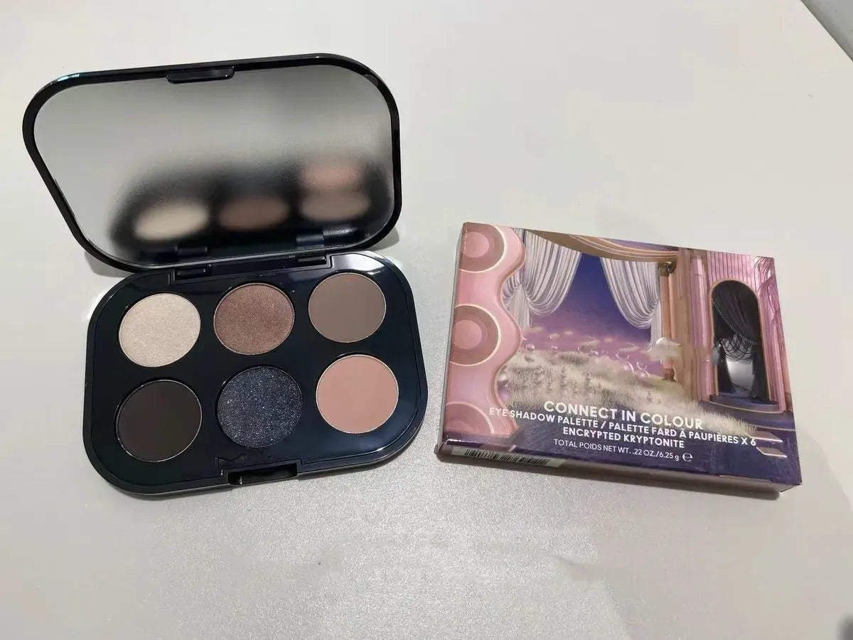 Close-up of eye shadow palette showing multiple complementary shades