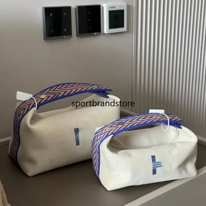 Vanity case being carried as crossbody bag with cosmetics visible