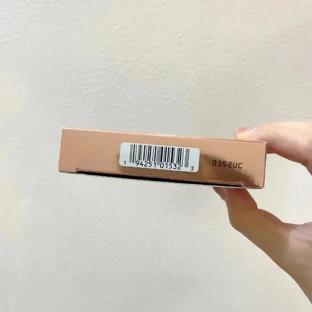 Eyeshadow palette open with swatches of matte and shimmer colors