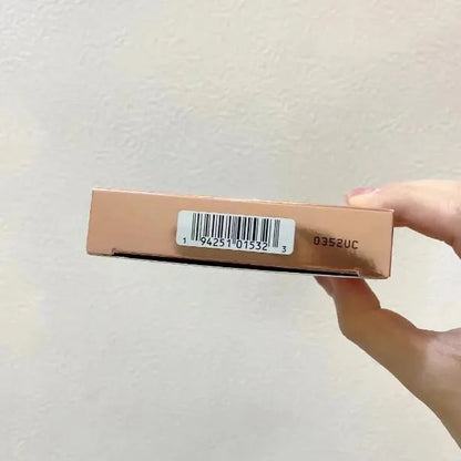 Eyeshadow palette open with swatches of matte and shimmer colors