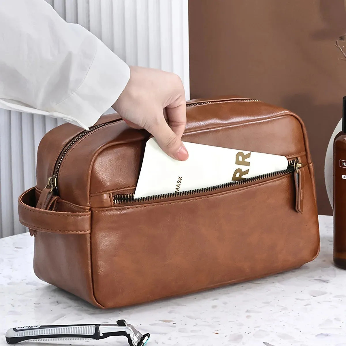 Waterproof PU leather toiletry bag in black color with zippered closure