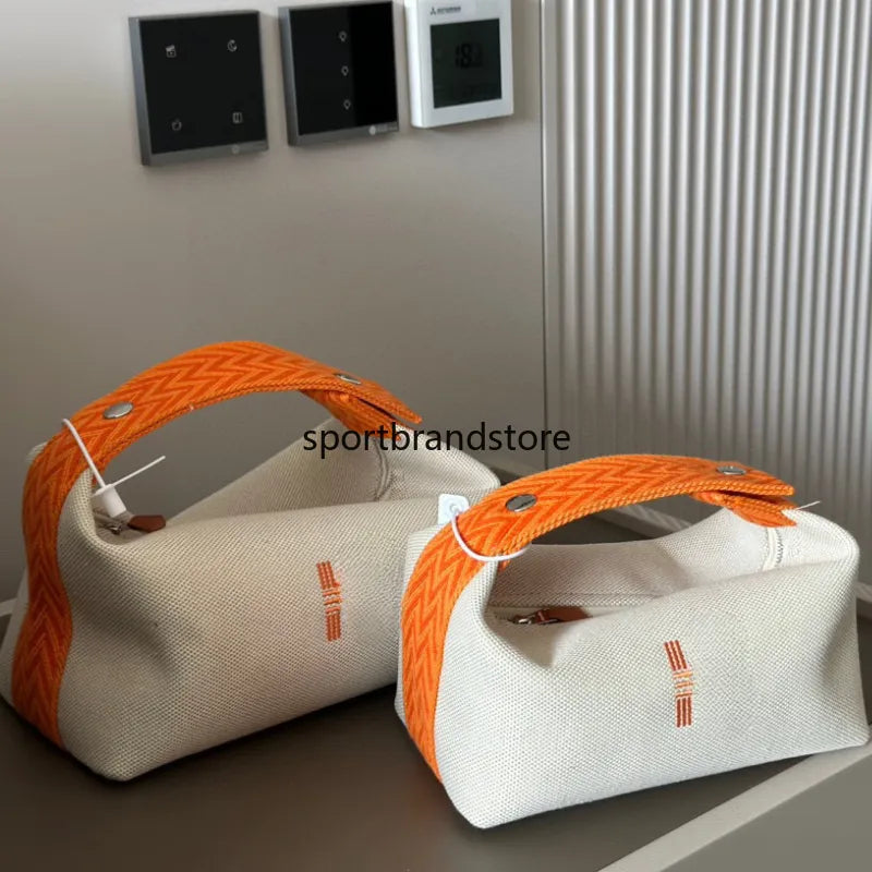 Structured mini box vanity case showing interior compartments