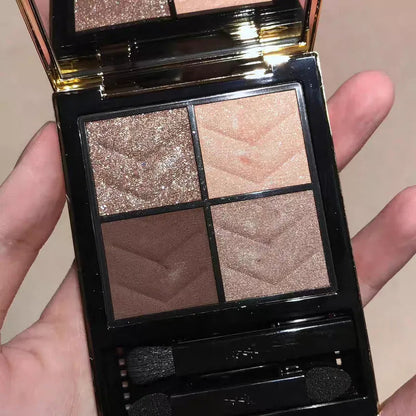 Four eyeshadow shades displayed in a rectangular compact palette