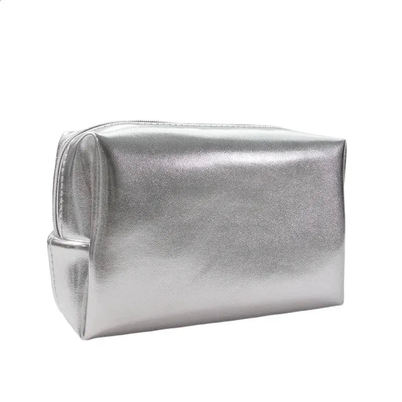 Clutch cosmetic bag held in hand to demonstrate portable size and design