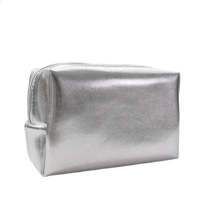 Clutch cosmetic bag held in hand to demonstrate portable size and design