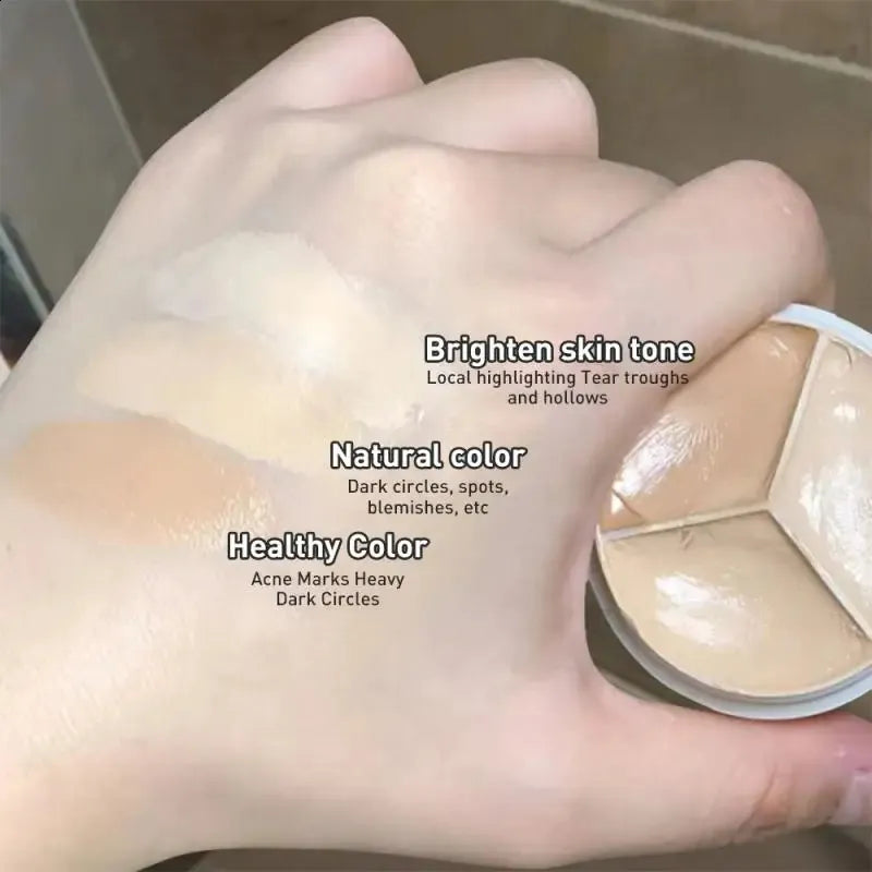 Close-up view of creamy concealer texture on a makeup brush