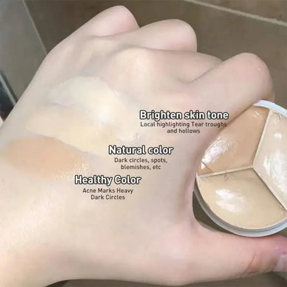 Close-up view of creamy concealer texture on a makeup brush