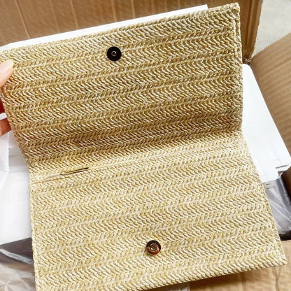 Straw clutch with pearl chain strap in black color