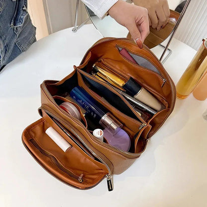 Interior view of makeup bag showing multiple compartments for organization