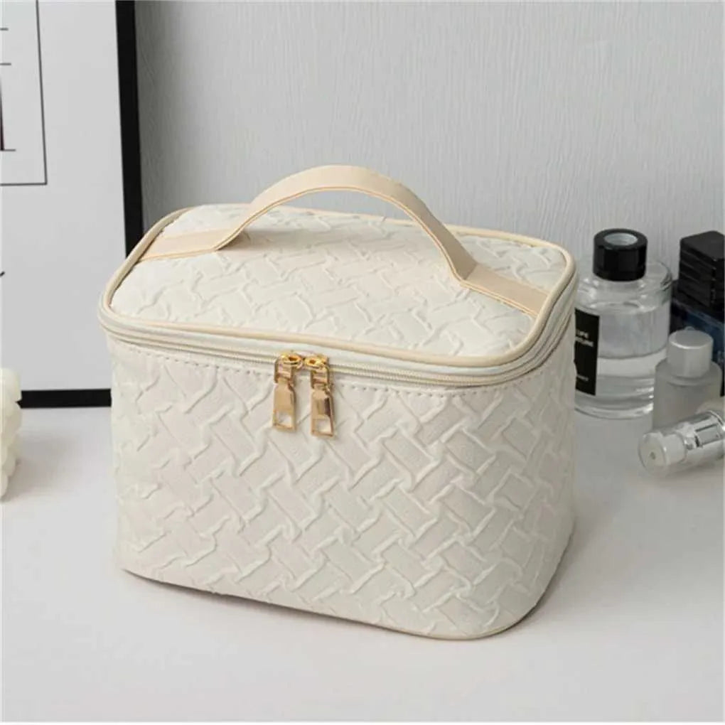 Open interior showing multiple organizer compartments in makeup bag