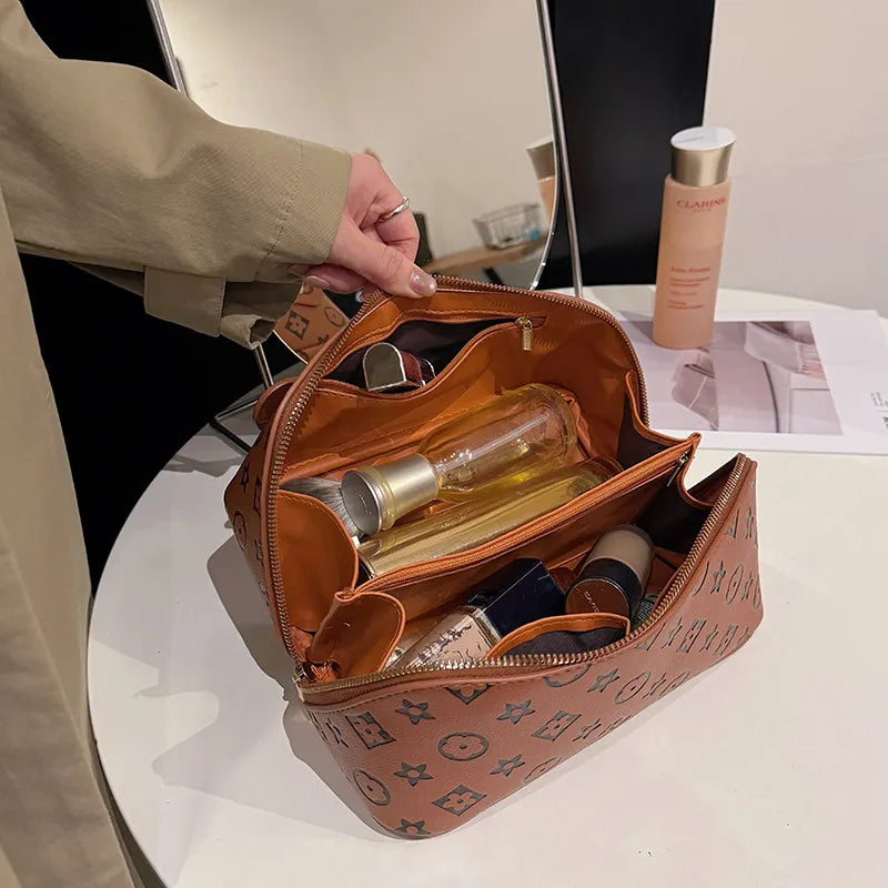 Open view of the pouch showing large capacity interior for travel organization
