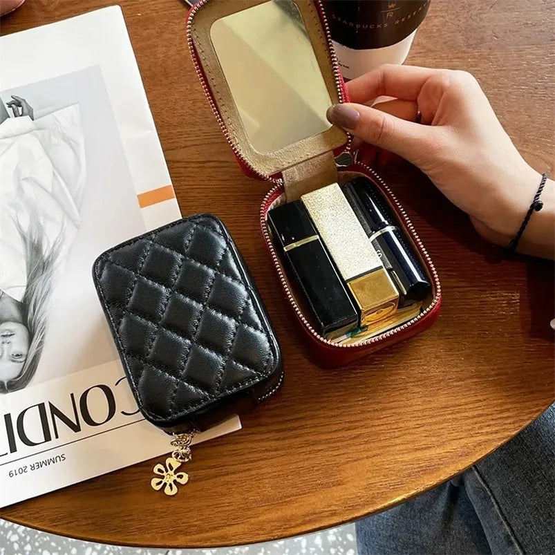 Compact leather lipstick bag with zipper closure shown closed