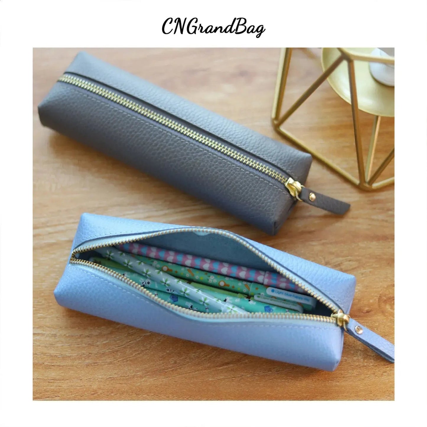 Open view of leather pen box interior showing organized stationery storage