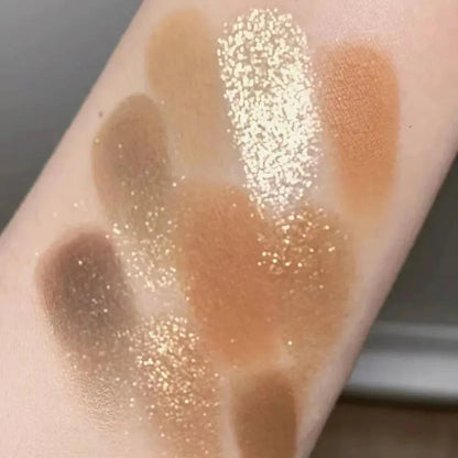 Close-up view of matte and glitter eyeshadow textures in the palette