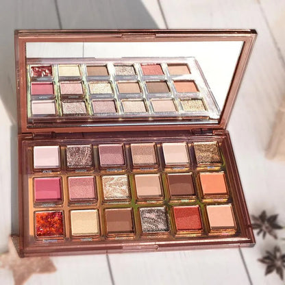 Eyeshadow palette open with all 18 colors visible for selection