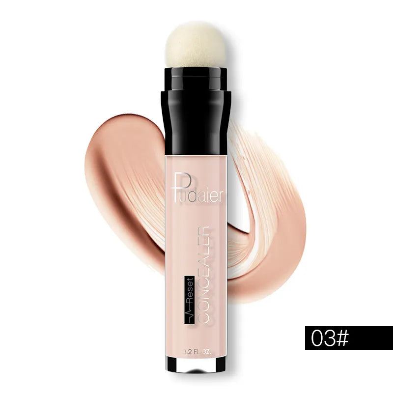 Hand holding concealer stick demonstrating application on skin