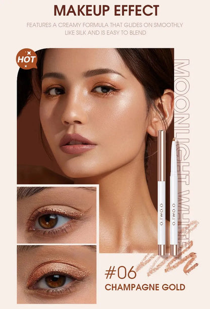 Hand holding an eyeshadow pen applying color to eyelid for demonstration